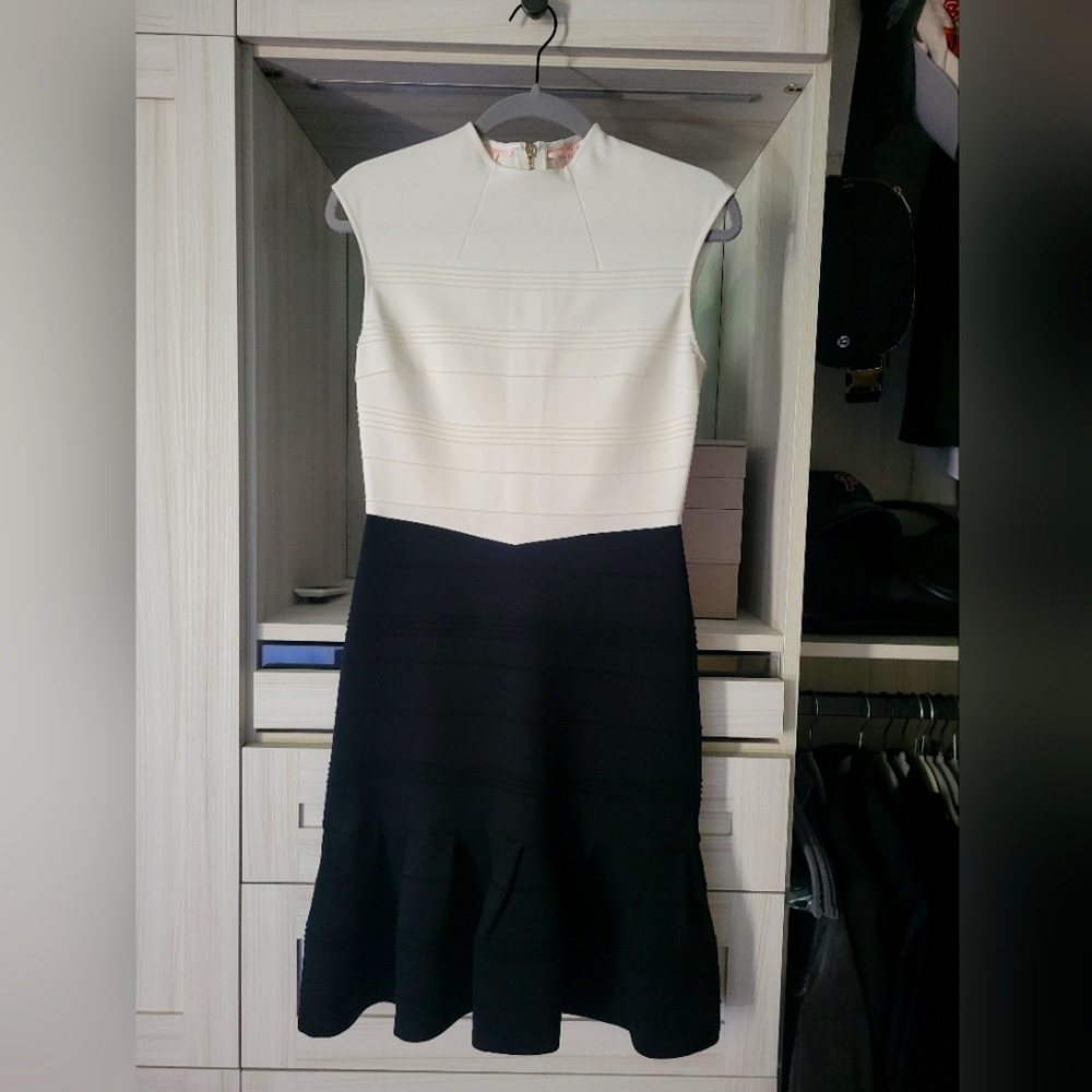 EXCELLENT Condition Ted Baker Size 2 (US 6) fitted with ruffle bottom detail.